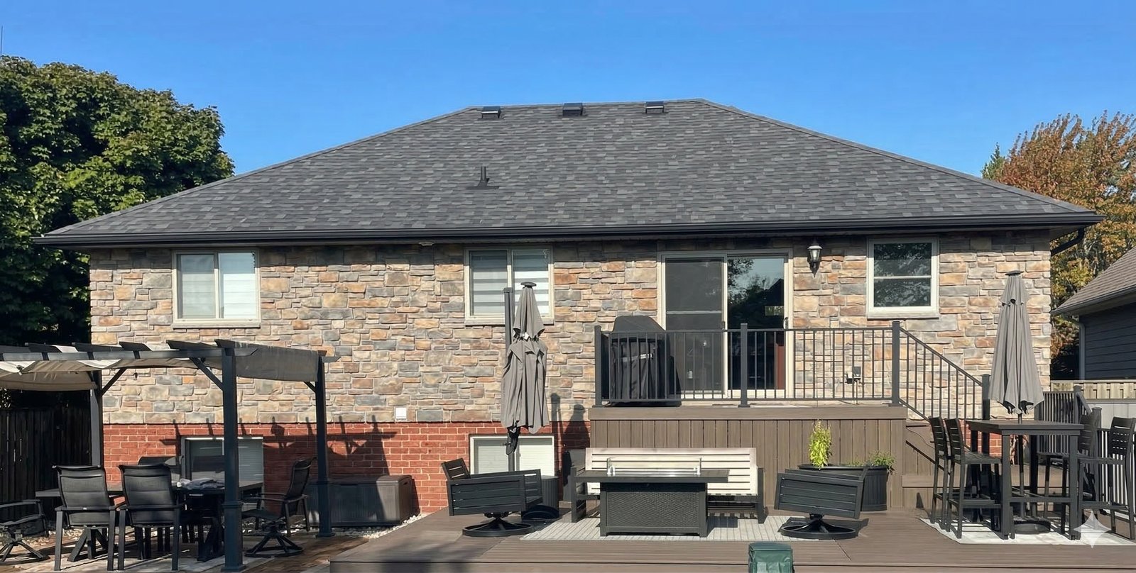 Stone house with weathered shingles before GreenSoy rejuvenation